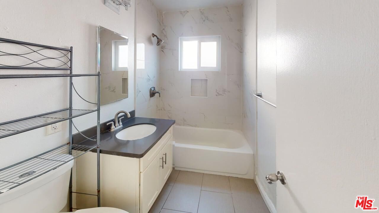 2129 Monroe Street Santa Clara, CA 95050 - Photo 9 of 12 a bathroom with a sink and a mirror