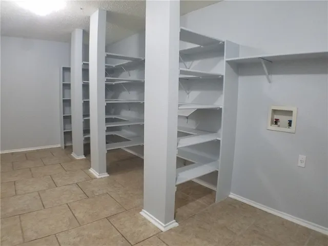 a view of an empty walk in closet