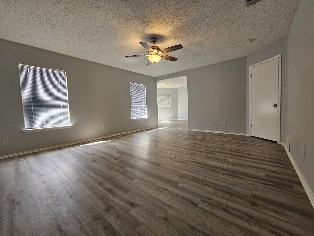 1113 Stillwell Ridge Cedar Park, TX 78613 - Photo 14 of 32 a view of an empty room with window and wooden floor
