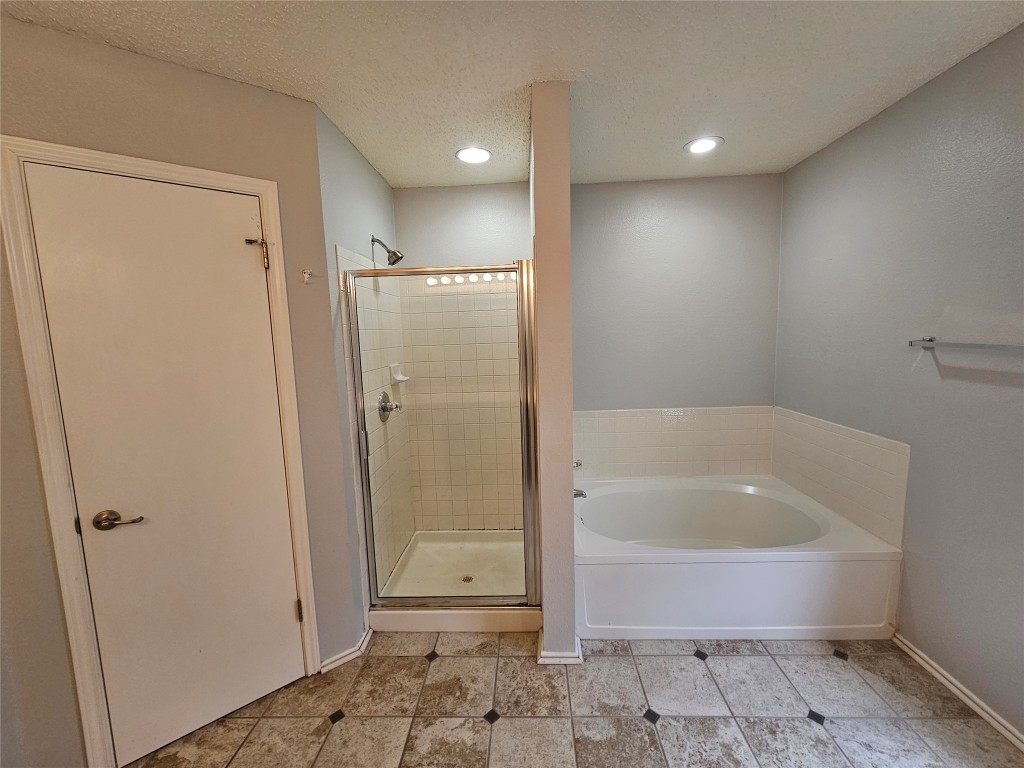 1113 Stillwell Ridge Cedar Park, TX 78613 - Photo 20 of 32 a bathroom with a bathtub and a shower