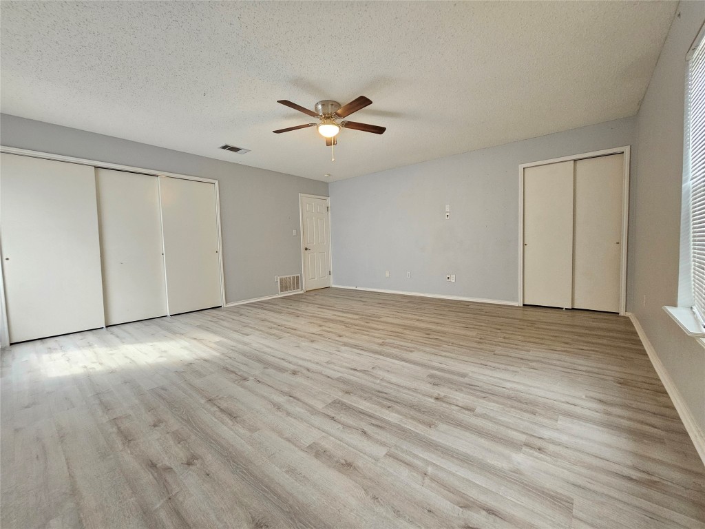 1113 Stillwell Ridge Cedar Park, TX 78613 - Photo 23 of 32 a view of an empty room with wooden floor