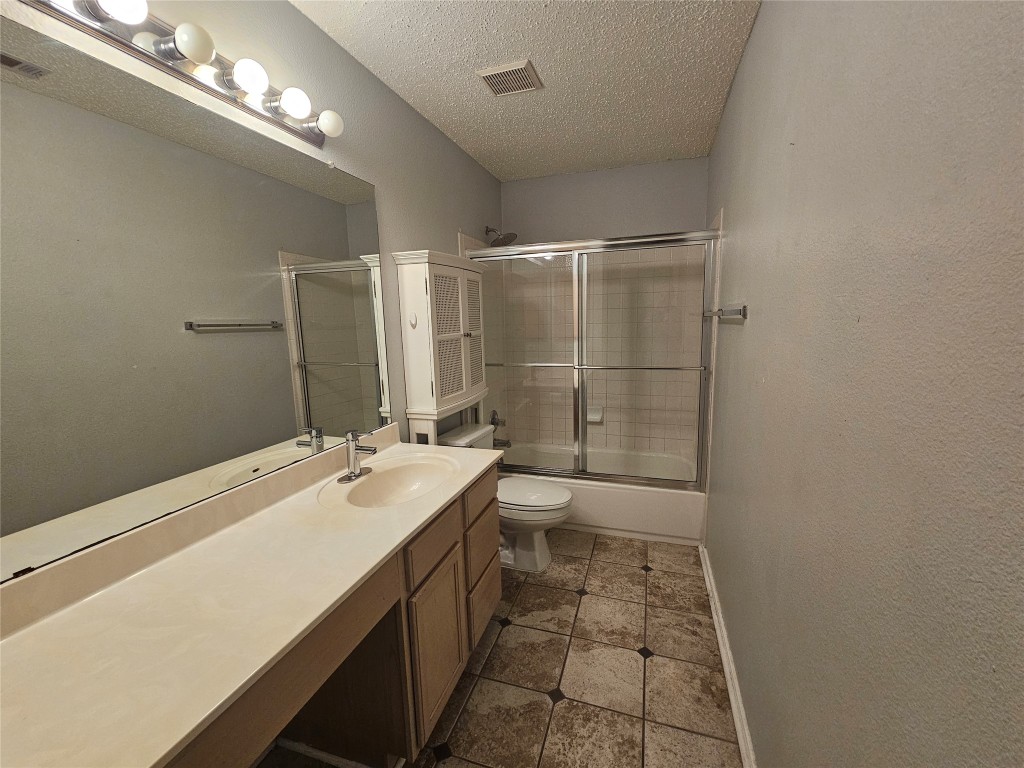 1113 Stillwell Ridge Cedar Park, TX 78613 - Photo 29 of 32 a bathroom with a sink a toilet a mirror and shower