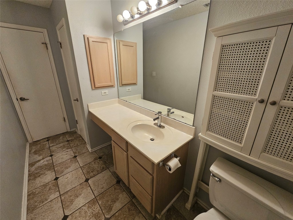 1113 Stillwell Ridge Cedar Park, TX 78613 - Photo 30 of 32 a bathroom with a sink toilet and mirror