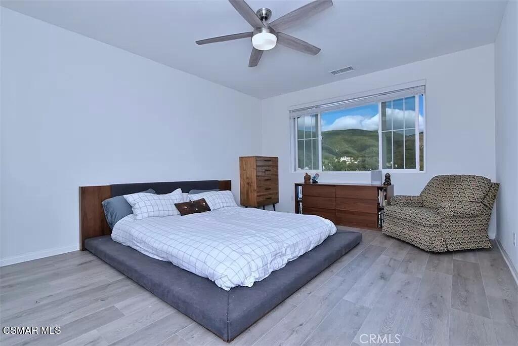 207 Morro Way, Unit 3 Simi Valley, CA 93065 - Photo 19 of 31 a bedroom with a large bed and a couch
