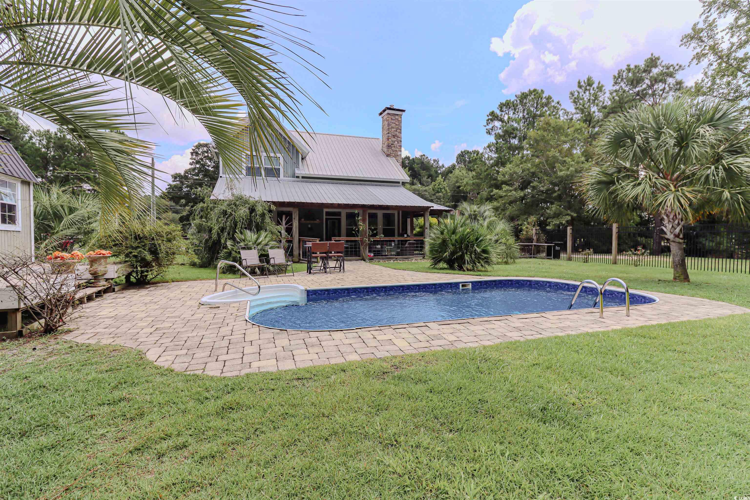 586 Loop Circle Longs, SC 29568 - Photo 3 of 33 View of swimming pool featuring a patio area and a