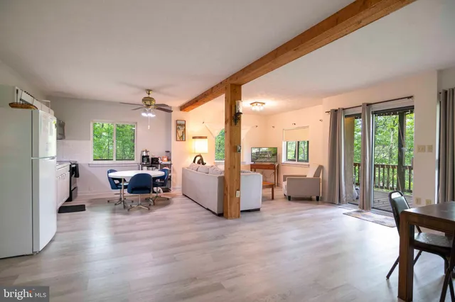 a bathroom with a sink toilet vanity and shower