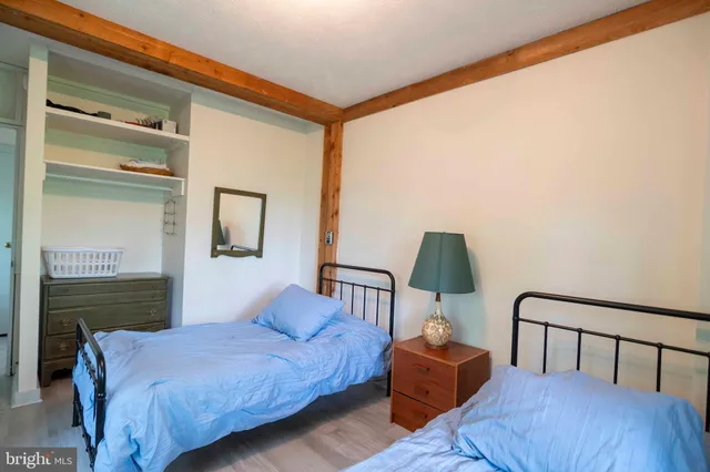 a view of a porch with wooden floor and stairs