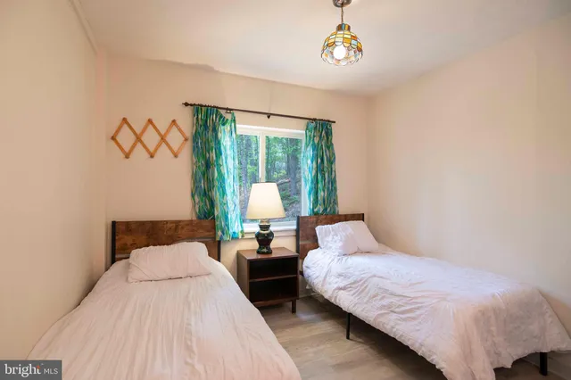 a living room with stainless steel appliances kitchen island granite countertop furniture and a rug
