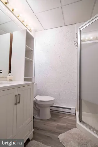 an aerial view of a swimming pool with a yard