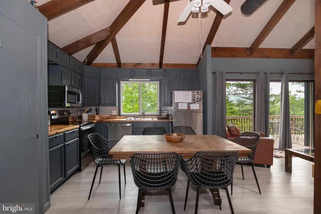 a bathroom with a sink a toilet and shower curtain