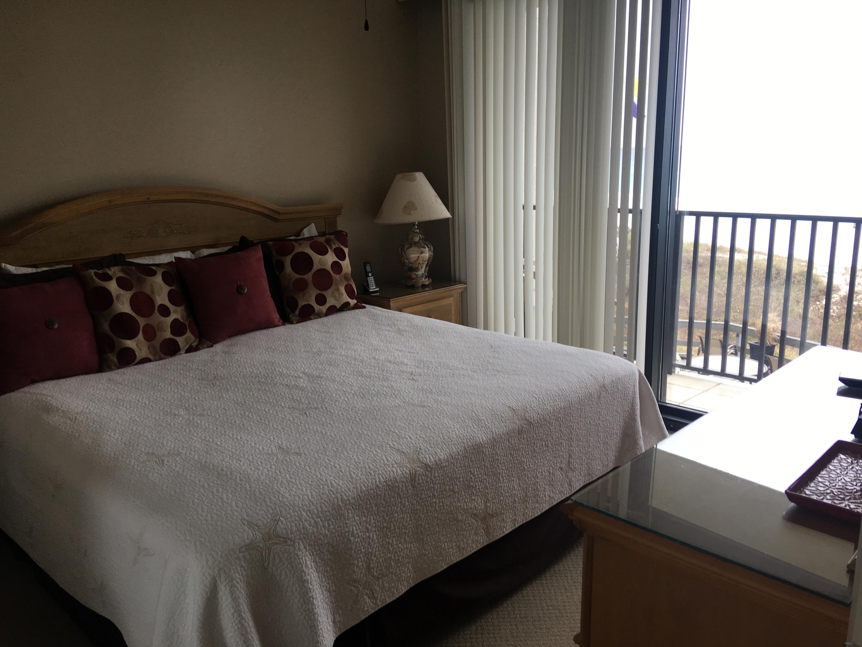 4100 East County Highway 30A, Unit 204 Santa Rosa Beach, FL 32459 - Photo 6 of 27 a bed sitting in a bedroom next to a window