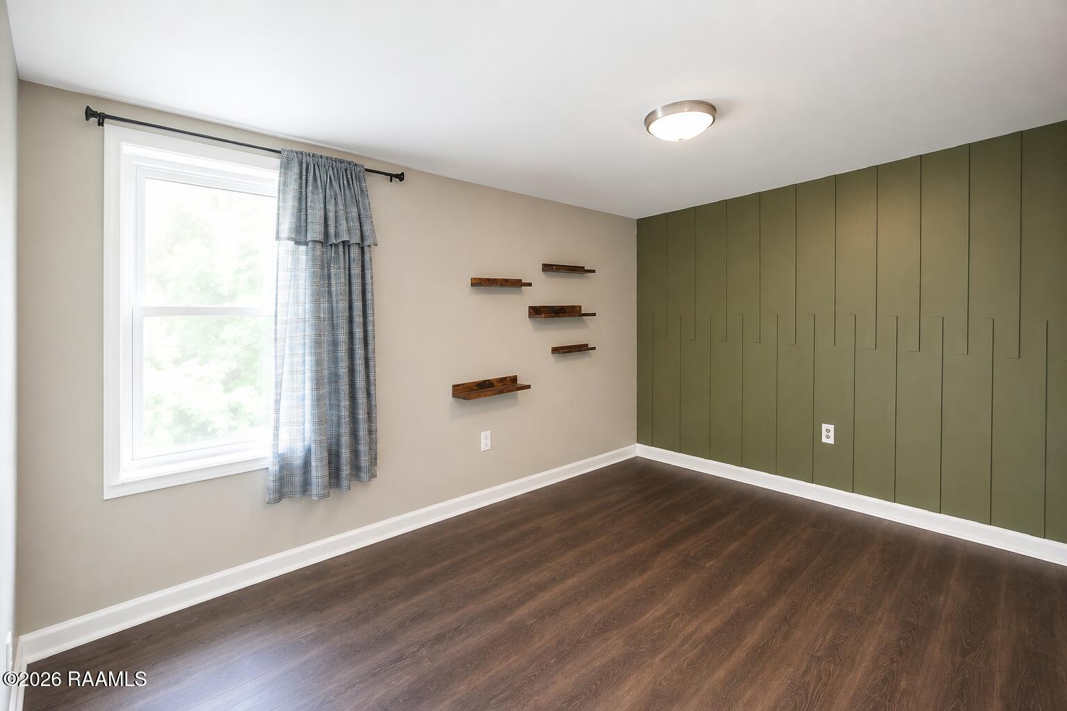 156 Oak Road Church Point, LA 70525 - Photo 11 of 17 Brightened MLS-ready room with green wal