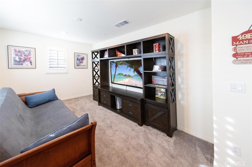 32078 Rambling Court Winchester, CA 92596 - Photo 25 of 48 a living room with furniture and a flat screen tv