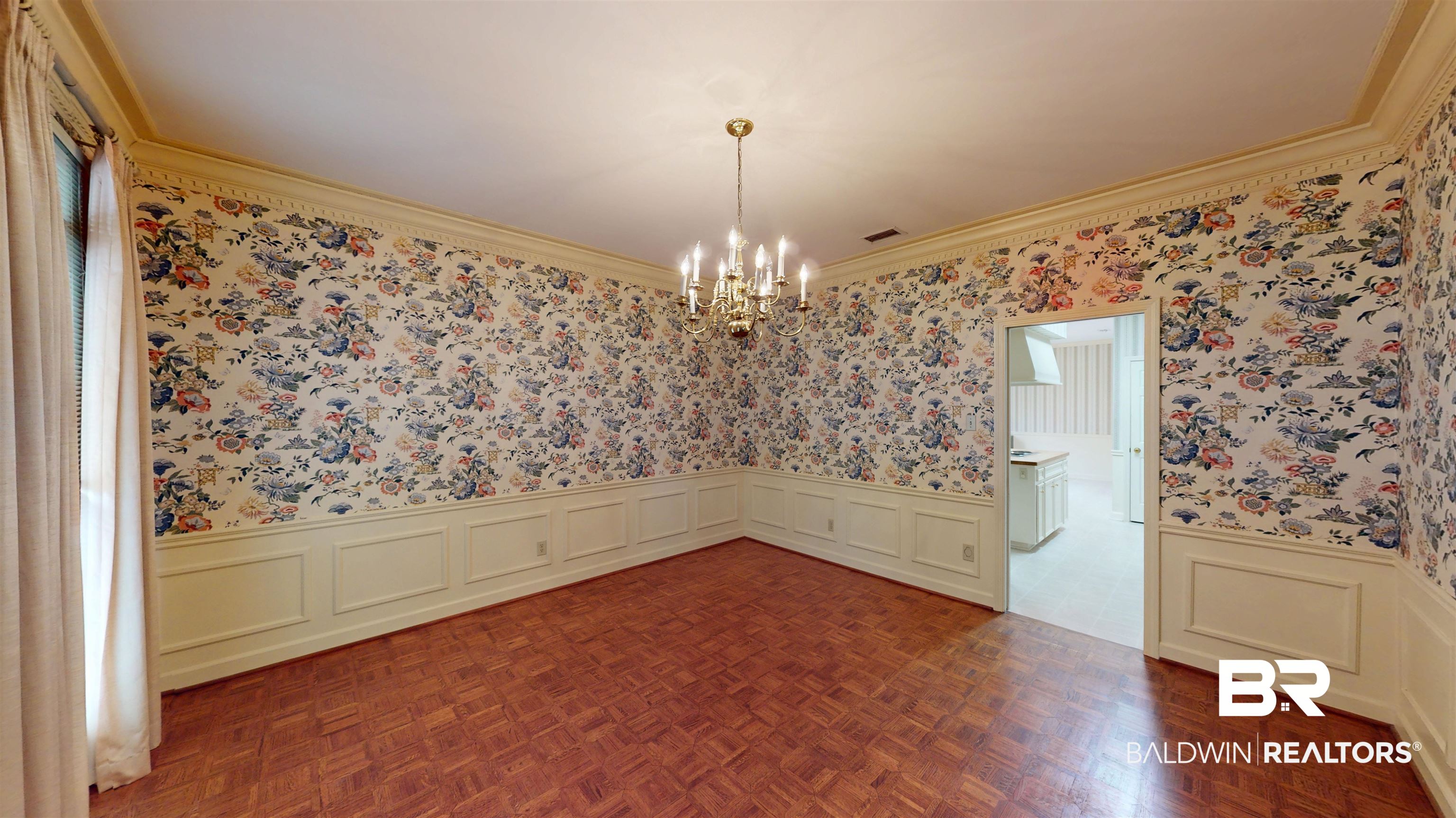 53 Warwick Road Mobile, AL 36608 - Photo 15 of 45 Unfurnished dining area with a wainscoted wall, wallpapered walls, a decorative wall, and a chandelier