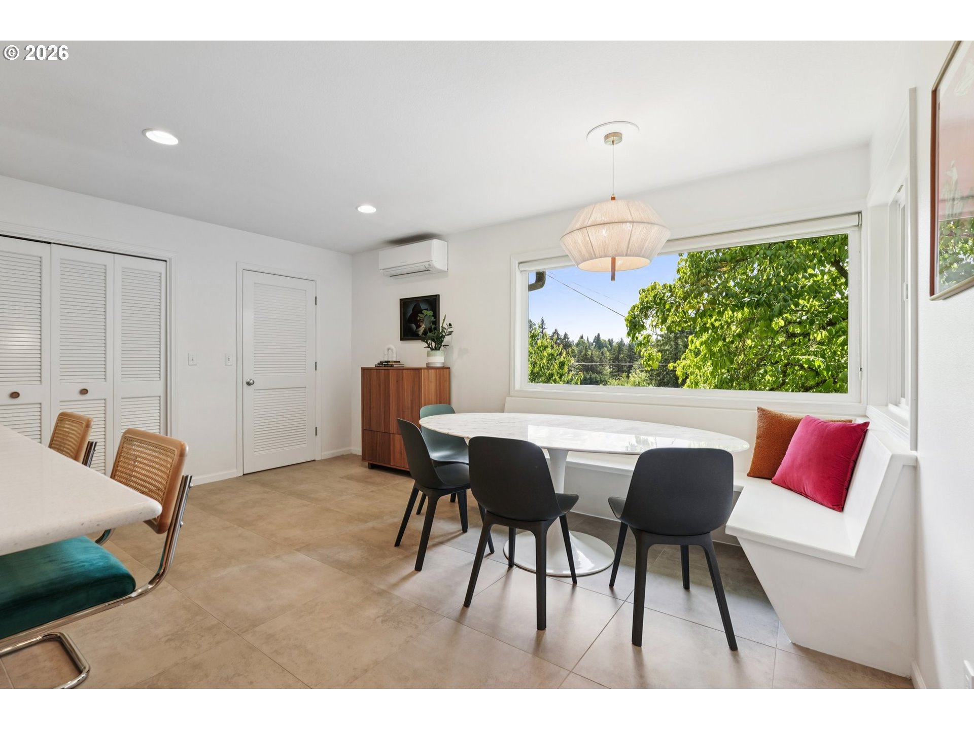 7225 Southwest 13th Avenue Portland, OR 97219 - Photo 13 of 48 a dining room with furniture and a large window