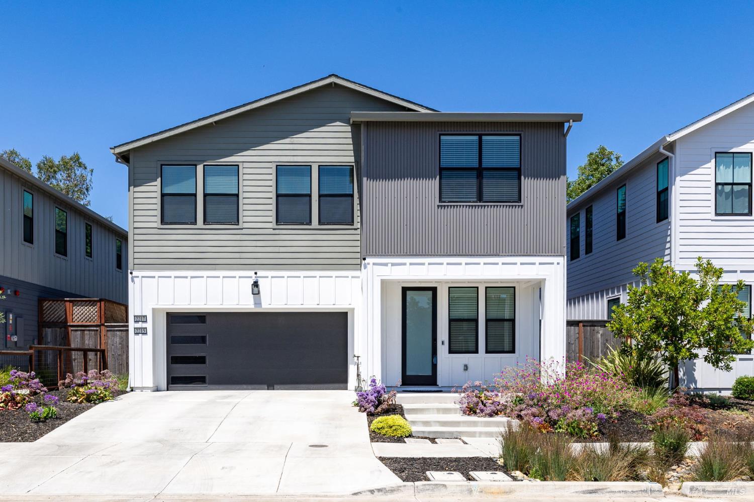 2215-2217 Versaro Drive Santa Rosa, CA 95403 - Photo 2 of 45 a front view of a house with a yard