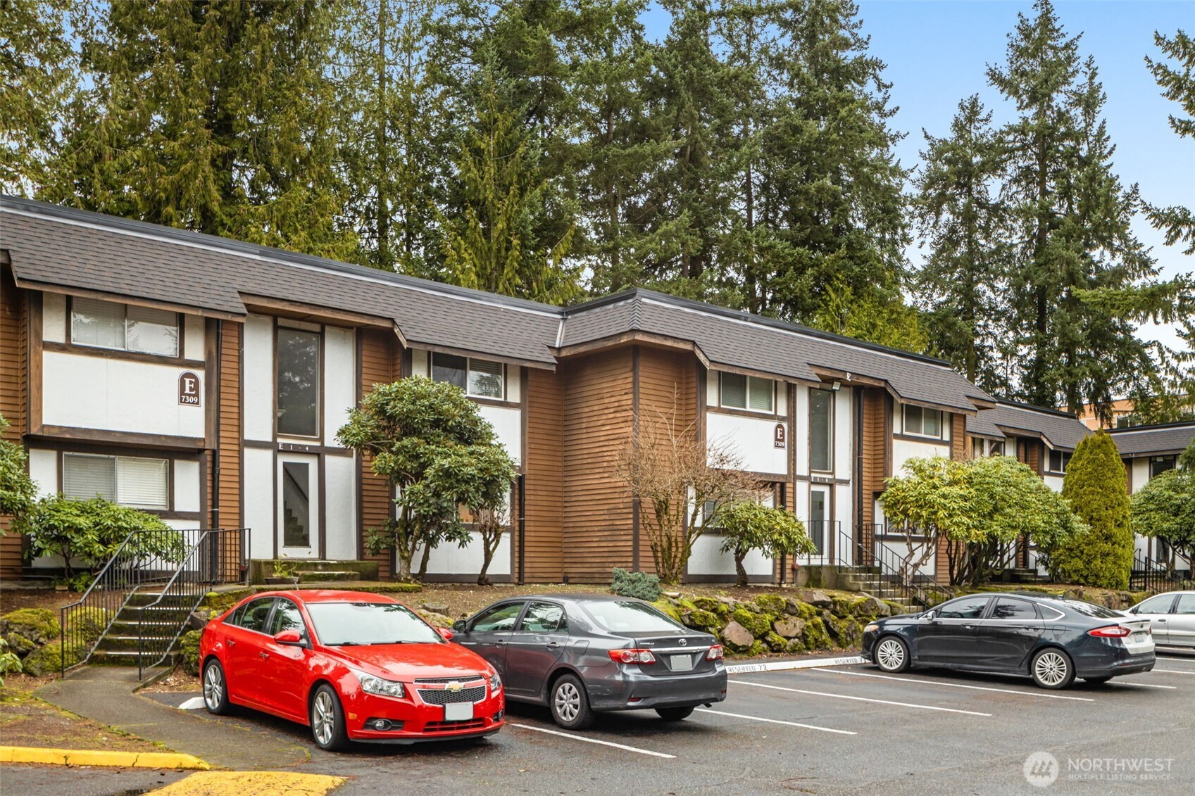 7309 224th Street Southwest, Unit E10 Edmonds, WA 98026 - Photo 3 of 11 a car parked in front of a house