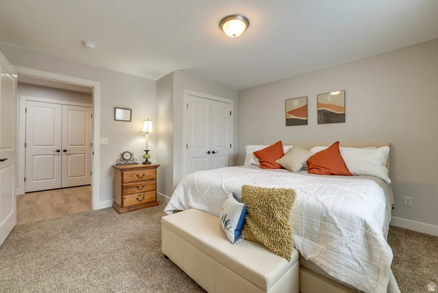 217 West Terrace Circle Toquerville, UT 84774 - Photo 20 of 25 Carpeted bedroom featuring a closet and baseboards