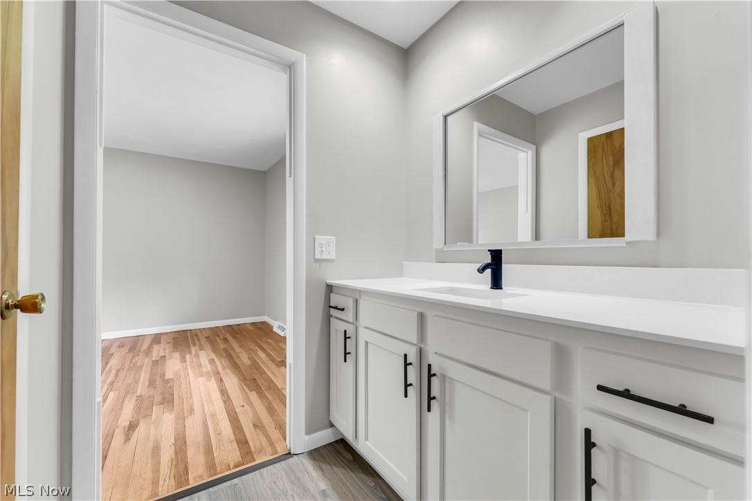 6190 Mill Road Broadview Heights, OH 44147 - Photo 33 of 36 Bathroom with hardwood / wood-style flooring and vanity