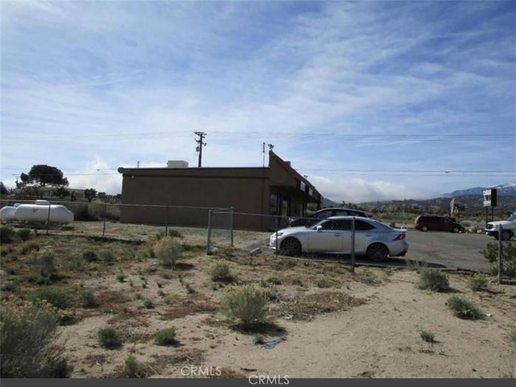 9757 Lebec Road Phelan, CA 92371 - Photo 8 of 10 a view of a car parked in front of a house