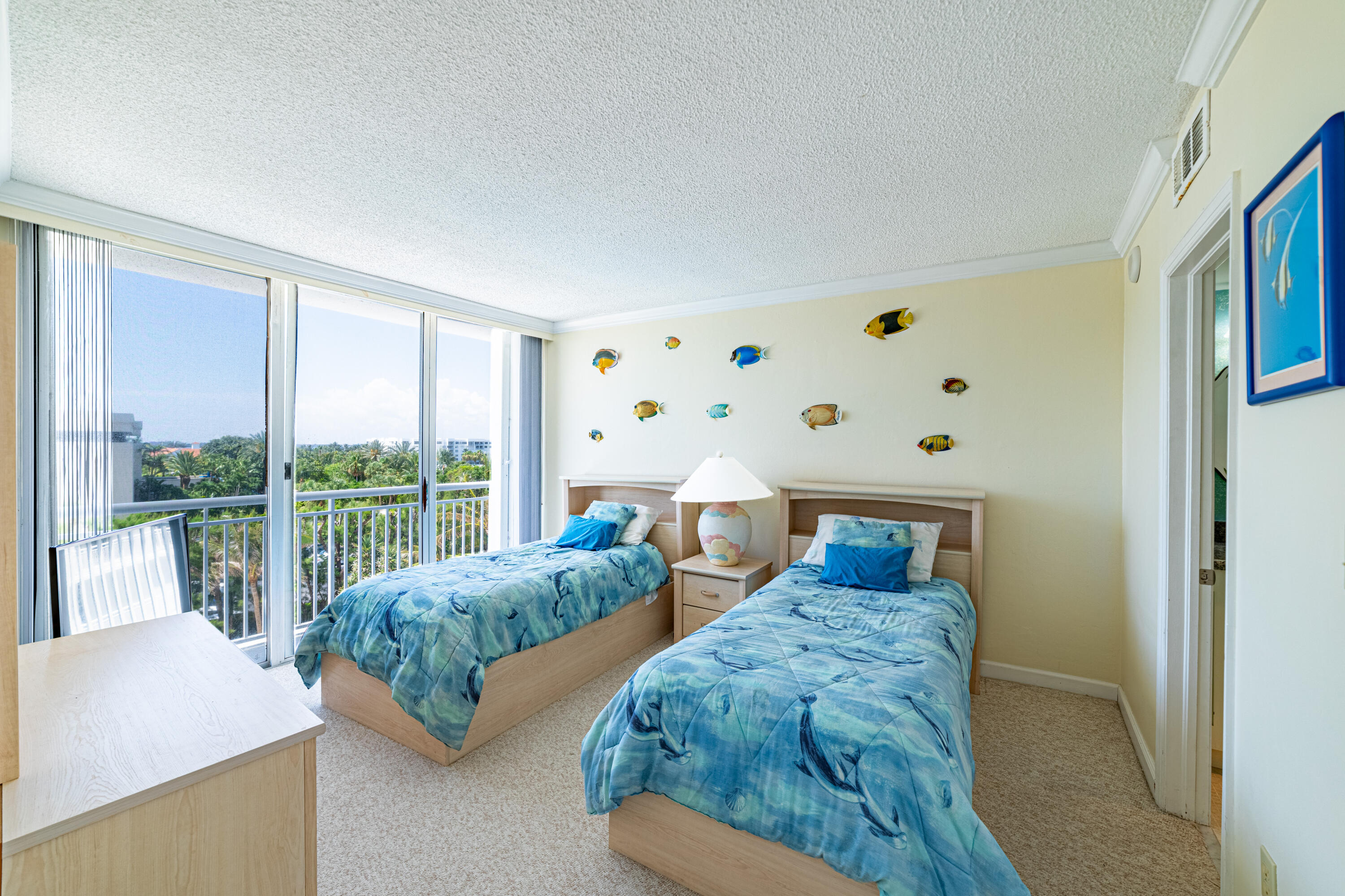 2780 South Ocean Boulevard, Unit 509 Palm Beach, FL 33480 - Photo 11 of 41 a bedroom with two beds and large window