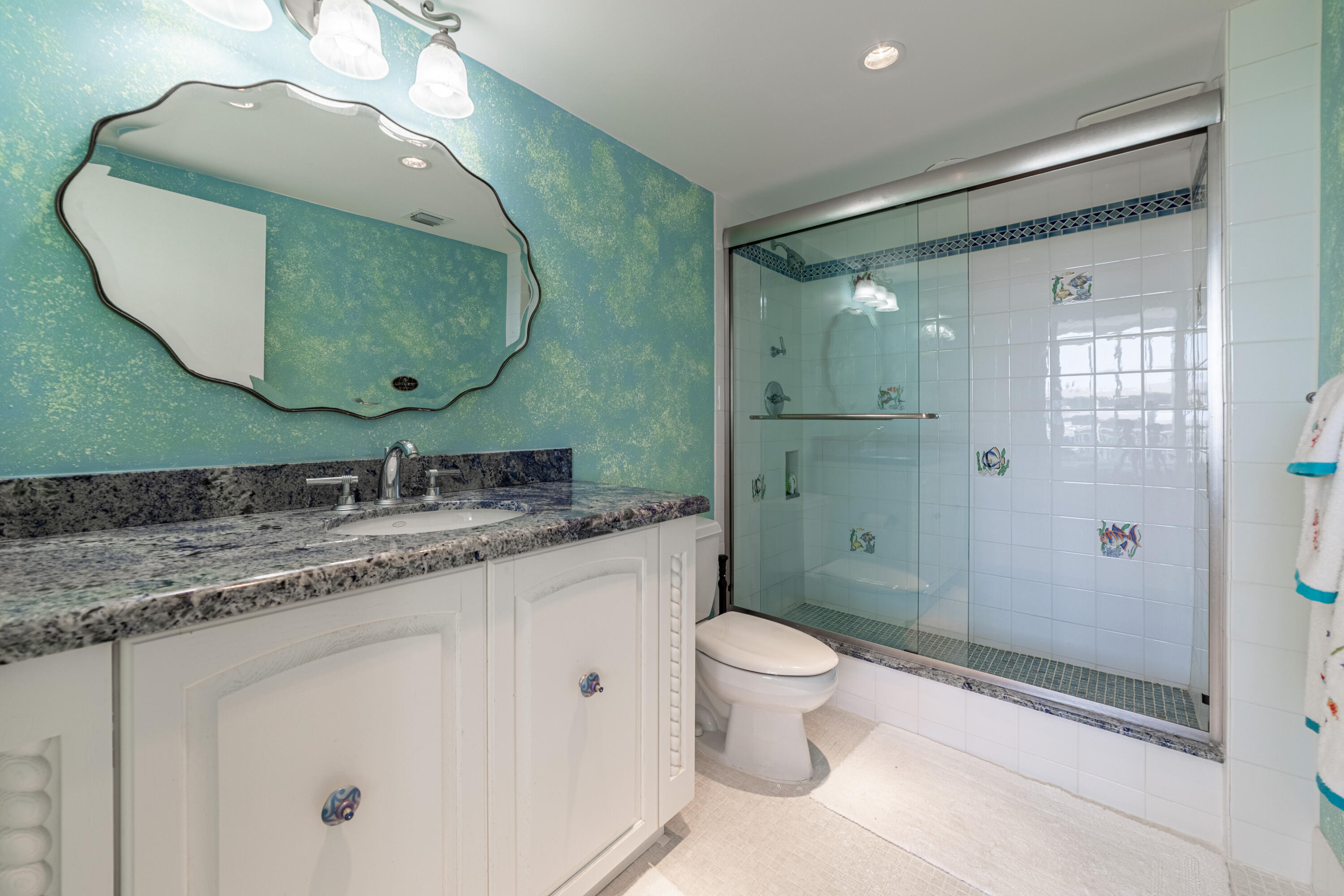 2780 South Ocean Boulevard, Unit 509 Palm Beach, FL 33480 - Photo 13 of 41 a bathroom with a granite countertop sink toilet and shower