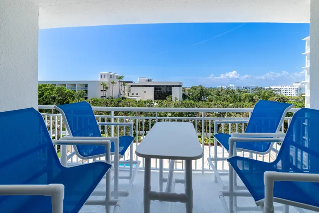 a view of a chairs and table on the terrace