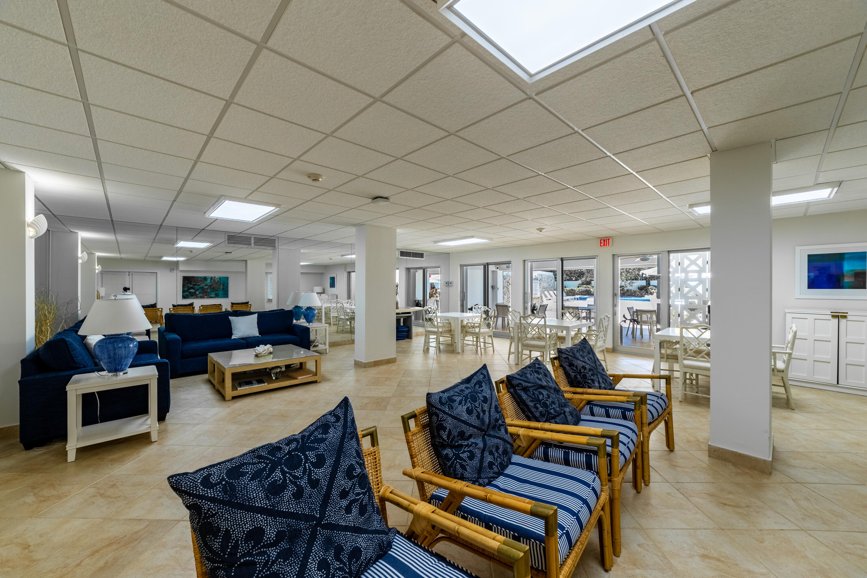 2780 South Ocean Boulevard, Unit 509 Palm Beach, FL 33480 - Photo 24 of 41 a living room with furniture a rug and a bookshelf