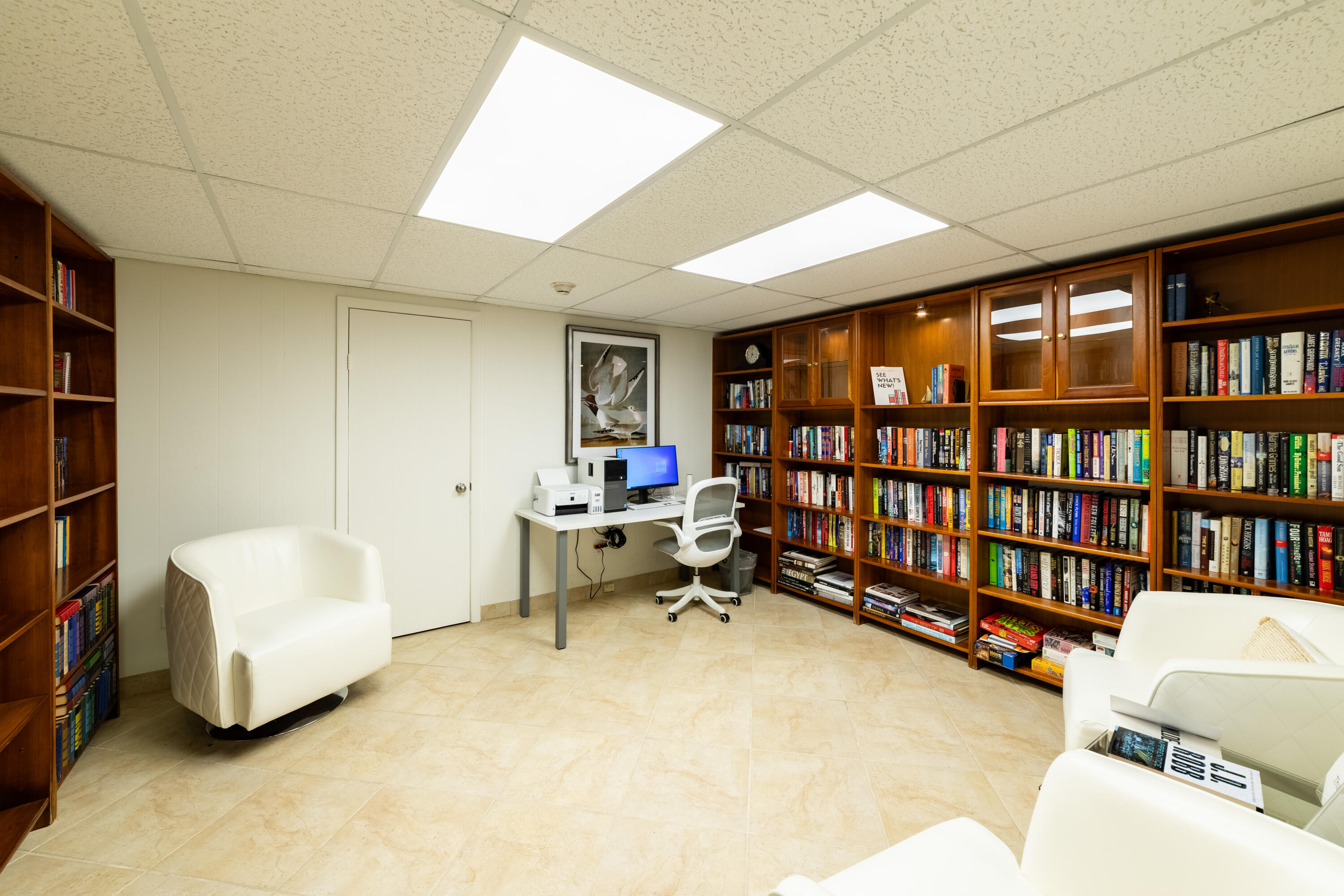 2780 South Ocean Boulevard, Unit 509 Palm Beach, FL 33480 - Photo 26 of 41 a living room with furniture and a book shelf