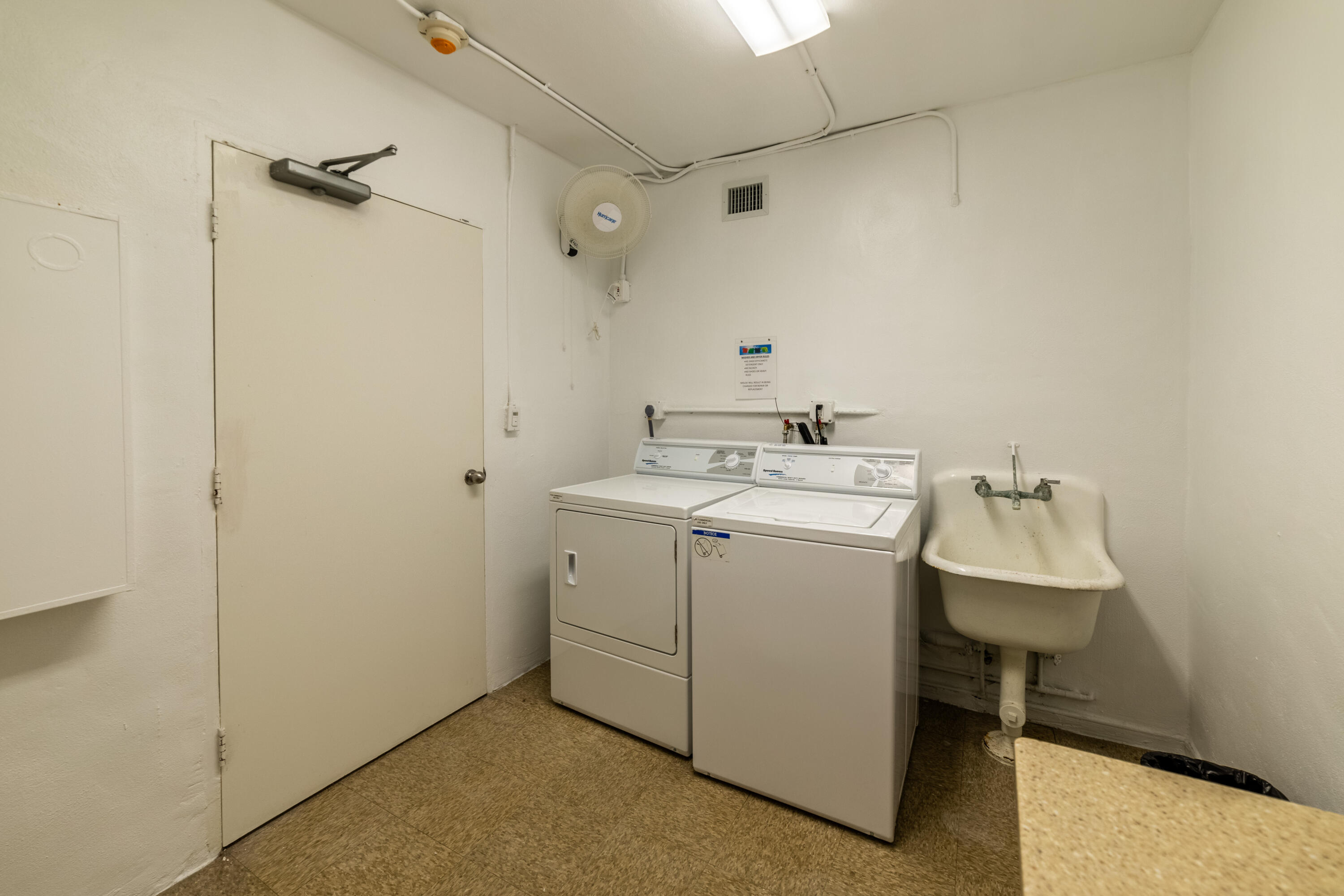 2780 South Ocean Boulevard, Unit 509 Palm Beach, FL 33480 - Photo 28 of 41 a utility room with a washer and dryer