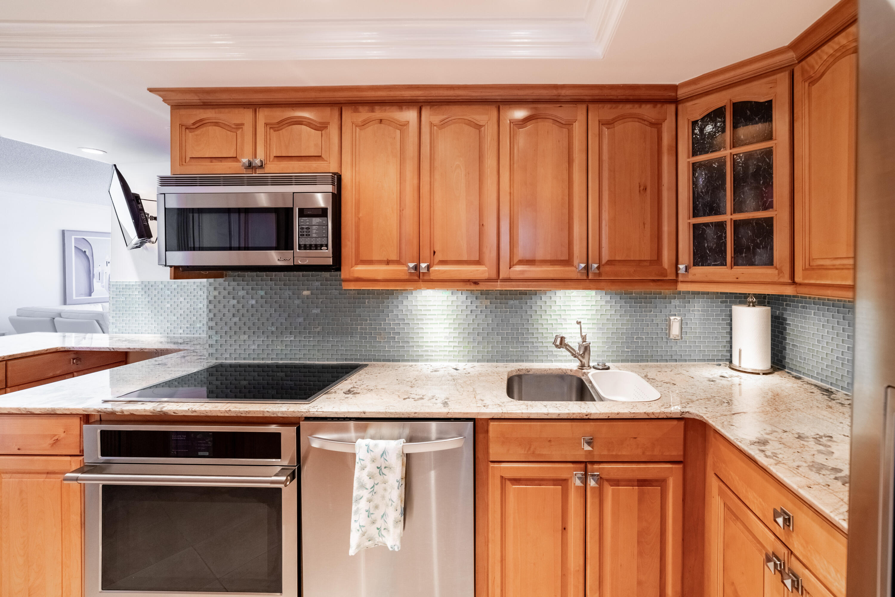 2780 South Ocean Boulevard, Unit 509 Palm Beach, FL 33480 - Photo 6 of 41 a kitchen with stainless steel appliances granite countertop a stove microwave and cabinets