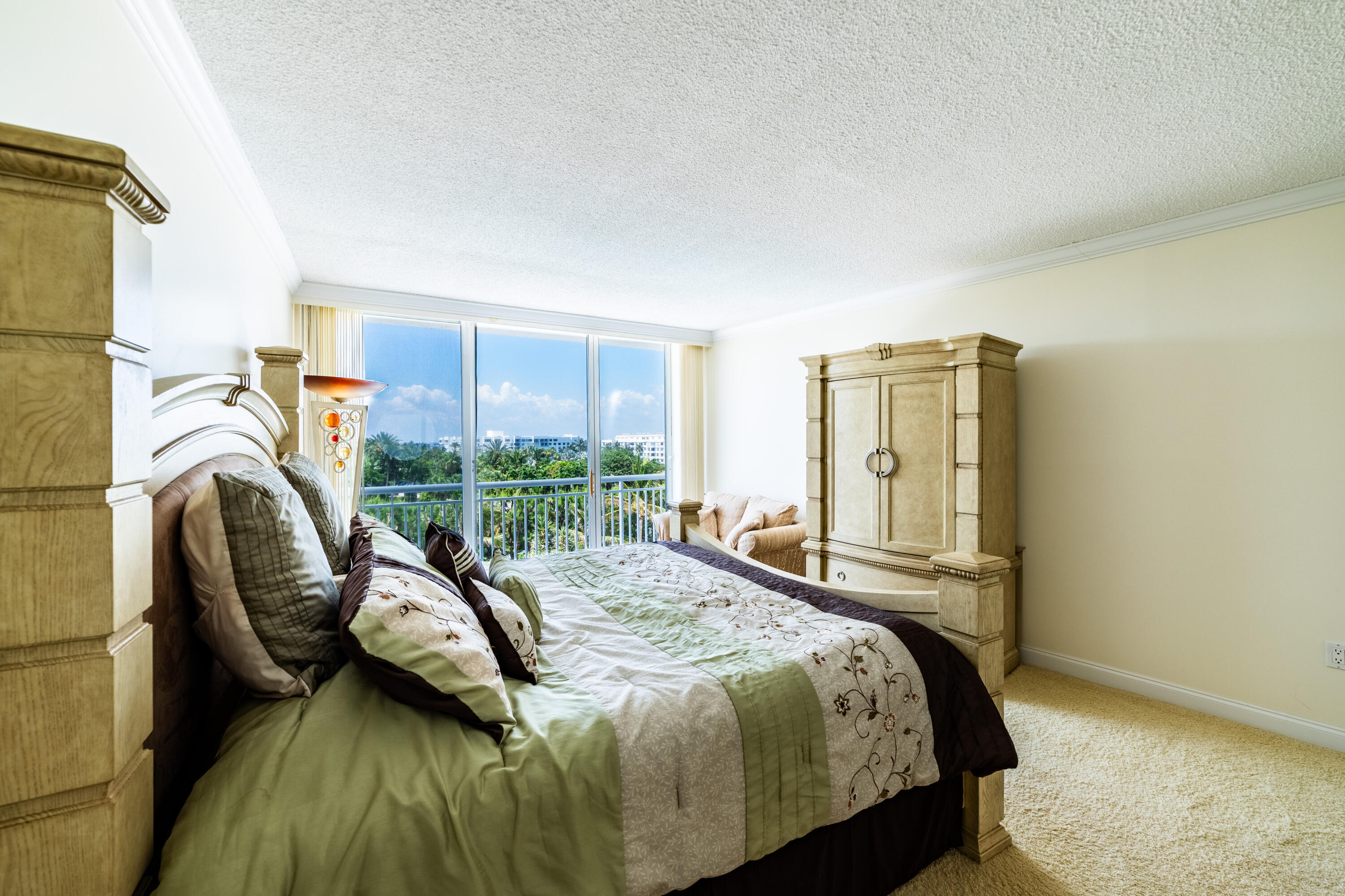 2780 South Ocean Boulevard, Unit 509 Palm Beach, FL 33480 - Photo 9 of 41 a bedroom with a bed chair and a large window