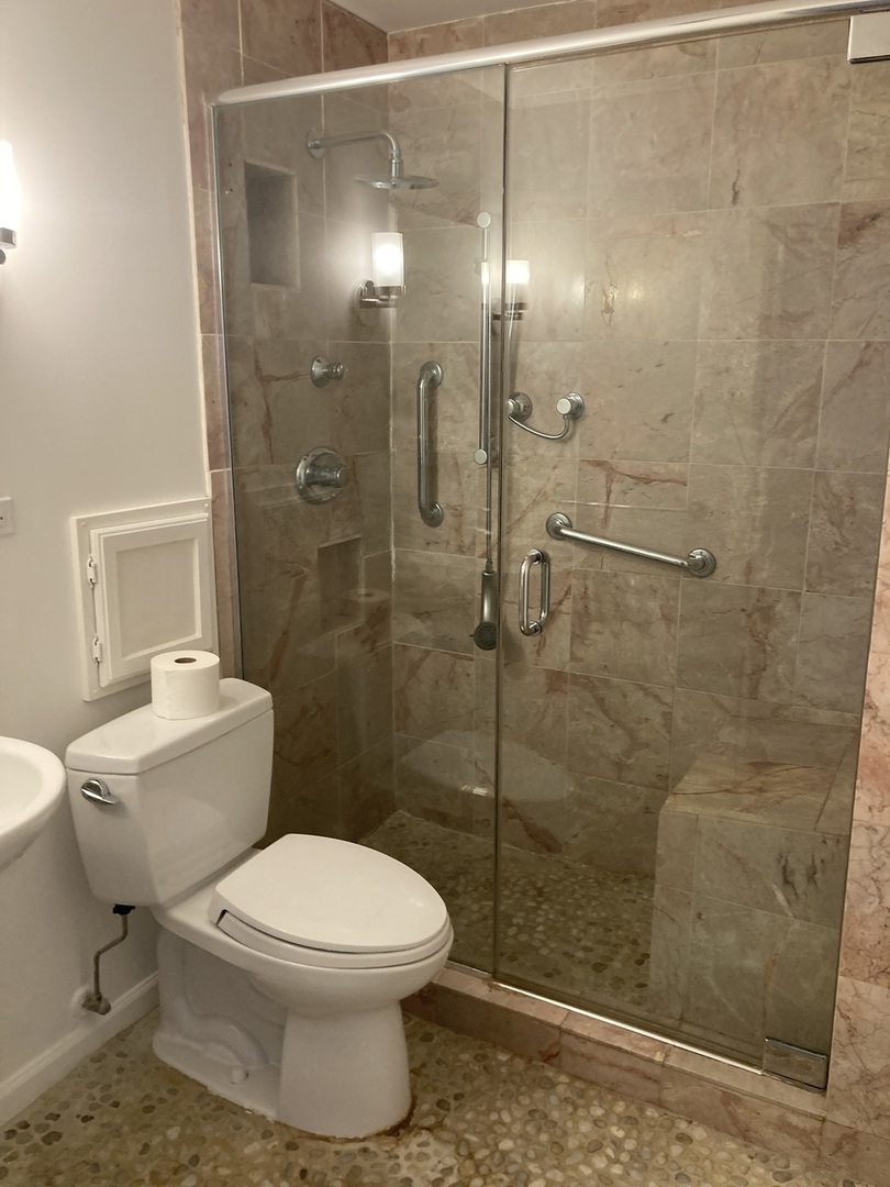 5445 North Sheridan Road, Unit 1409 Chicago, IL 60640 - Photo 7 of 7 a bathroom with a toilet and a shower