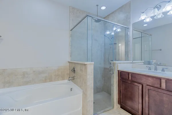 a bathroom with a bathtub and a sink