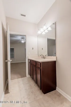 an empty room with a empty space and windows