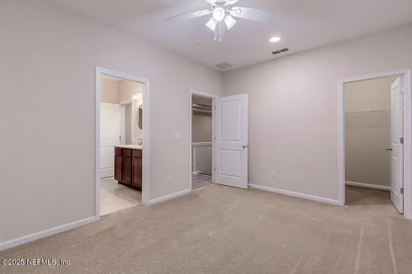 a view of a yard in front view of a house
