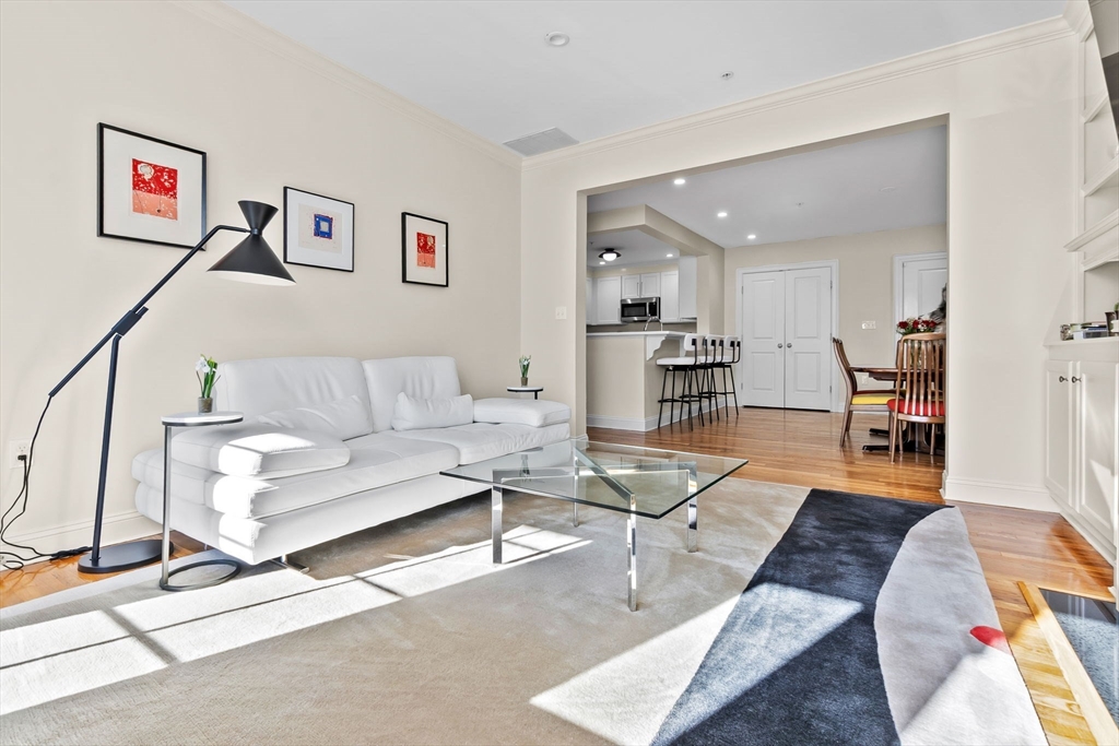 33 Intrepid Circle, Unit 208 Marblehead, MA 01945 - Photo 11 of 35 a living room with furniture and a wooden floor