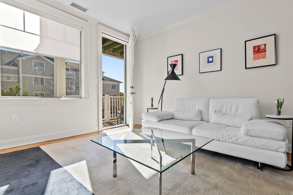 33 Intrepid Circle, Unit 208 Marblehead, MA 01945 - Photo 13 of 35 a living room with furniture and a window