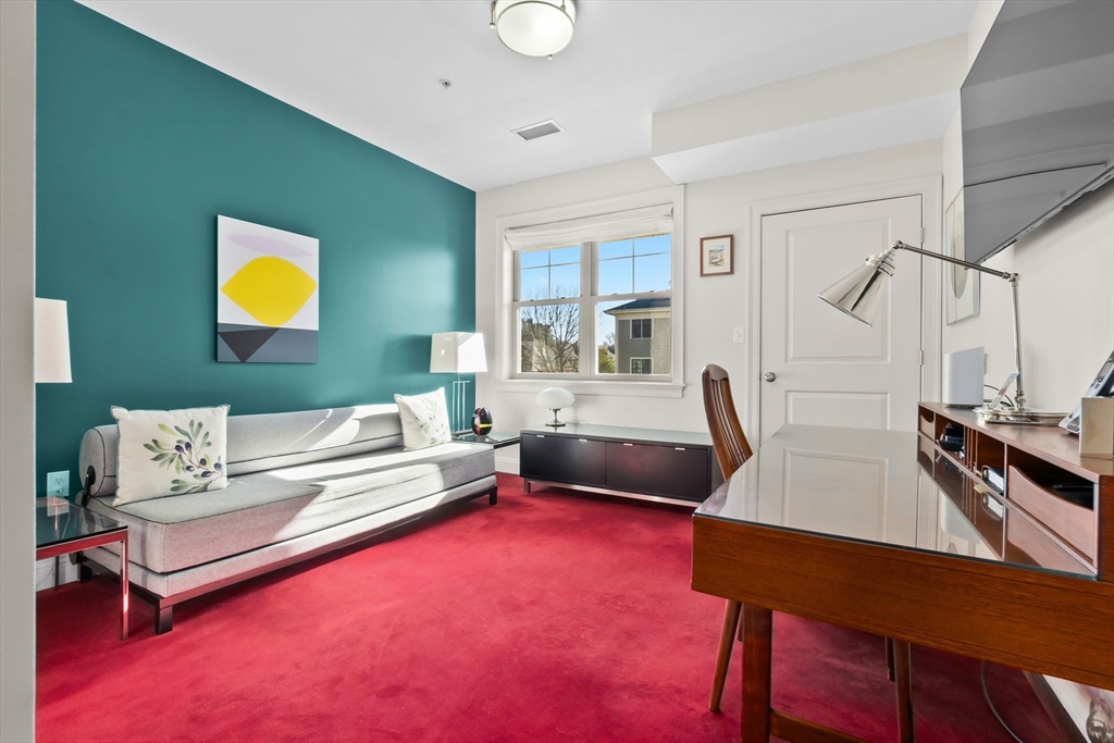33 Intrepid Circle, Unit 208 Marblehead, MA 01945 - Photo 27 of 35 a living room with furniture and a wooden floor