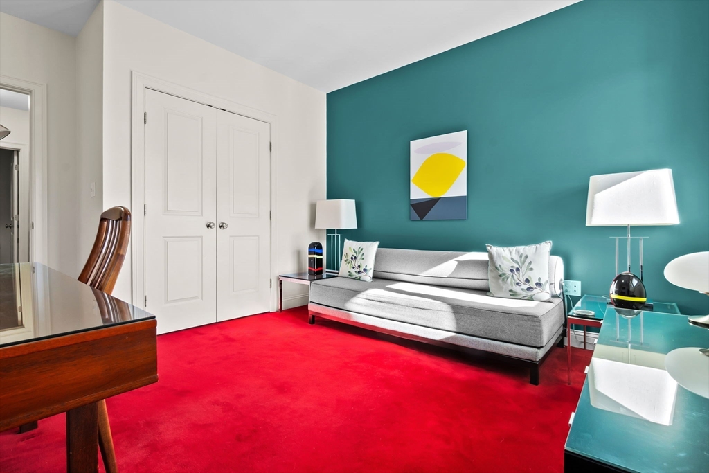 33 Intrepid Circle, Unit 208 Marblehead, MA 01945 - Photo 28 of 35 a living room with furniture and a rug