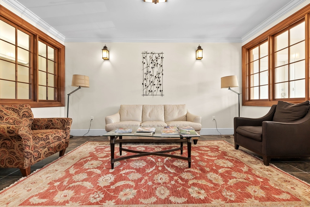 33 Intrepid Circle, Unit 208 Marblehead, MA 01945 - Photo 34 of 35 a living room with furniture and a window