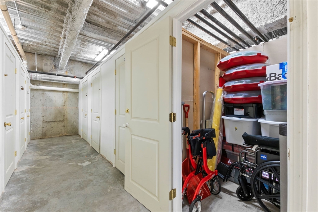 33 Intrepid Circle, Unit 208 Marblehead, MA 01945 - Photo 35 of 35 a view of walk in closet with clothes and shoes