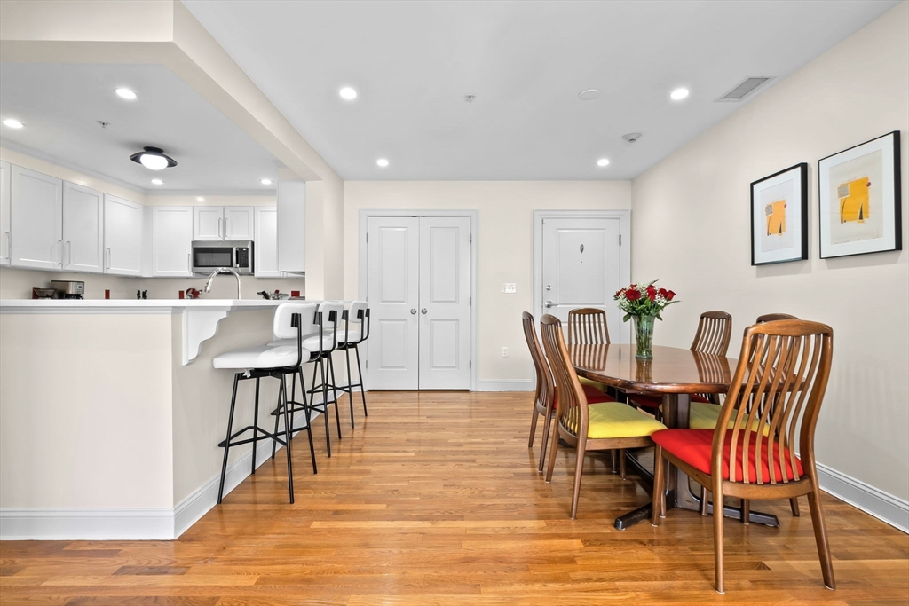 33 Intrepid Circle, Unit 208 Marblehead, MA 01945 - Photo 5 of 35 a view of kitchen with cabinets table and chairs