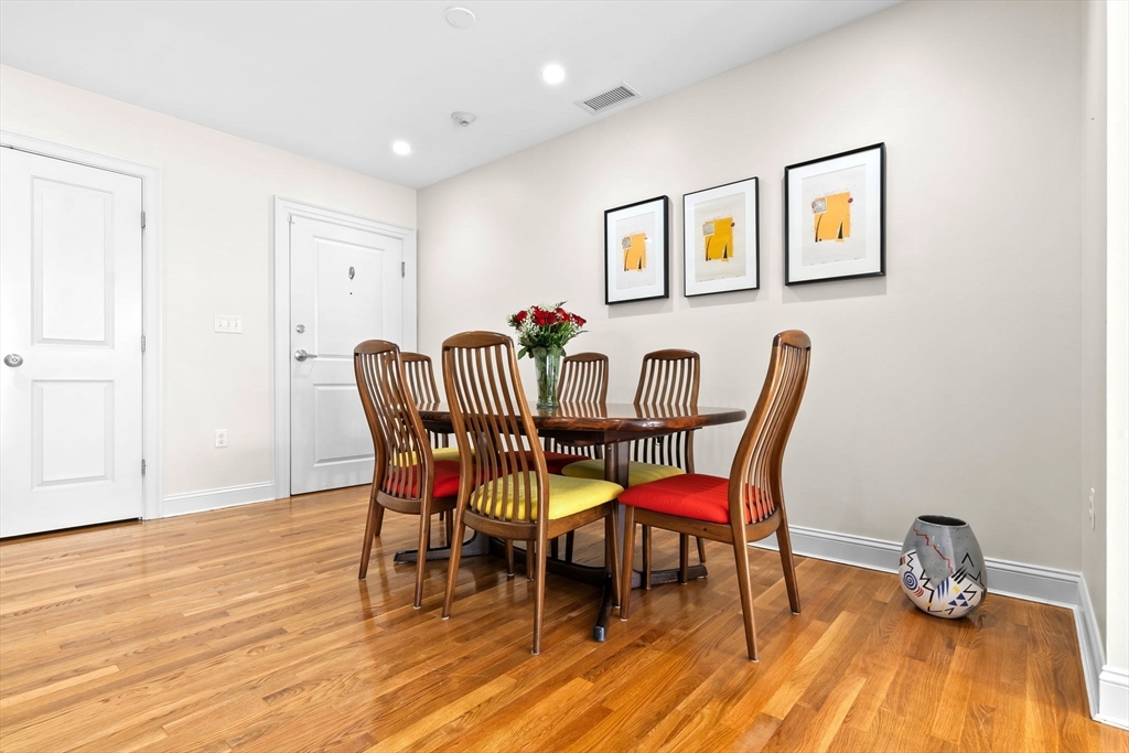 33 Intrepid Circle, Unit 208 Marblehead, MA 01945 - Photo 6 of 35 a dining room with furniture and wooden floor