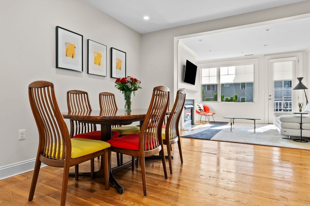 33 Intrepid Circle, Unit 208 Marblehead, MA 01945 - Photo 7 of 35 a view of a dining room with furniture window and wooden floor