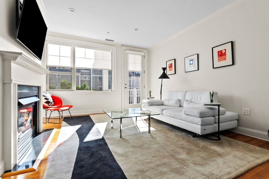 33 Intrepid Circle, Unit 208 Marblehead, MA 01945 - Photo 8 of 35 a living room with furniture and a flat screen tv