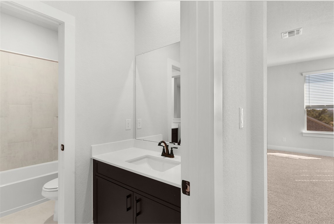 101 Golden Sage Avenue Georgetown, TX 78633 - Photo 16 of 24 a bathroom with a sink and a mirror
