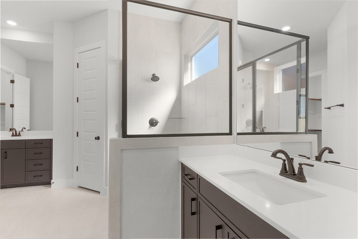 101 Golden Sage Avenue Georgetown, TX 78633 - Photo 8 of 24 a bathroom with a sink and a mirror