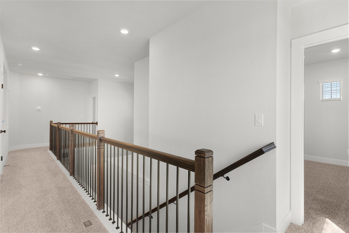 101 Golden Sage Avenue Georgetown, TX 78633 - Photo 9 of 24 Hall with light carpet, an upstairs landing, and recessed lighting