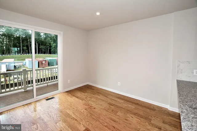 a view of a hardwood & staircase in a room